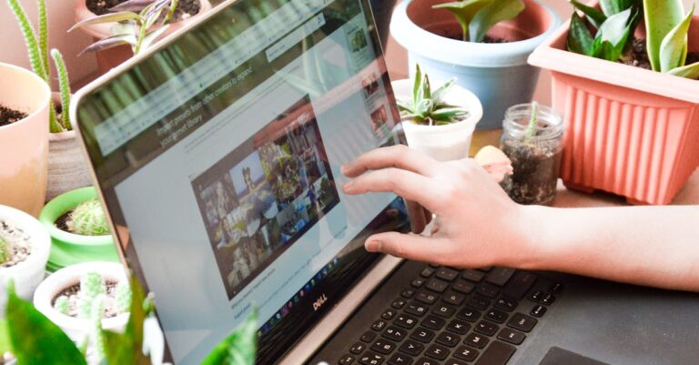 A woman engaging in online activities on a laptop surrounded by houseplants.